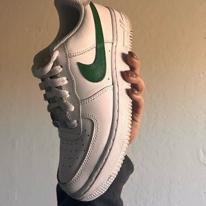 White Air Force 1’s with painted green Nike sign